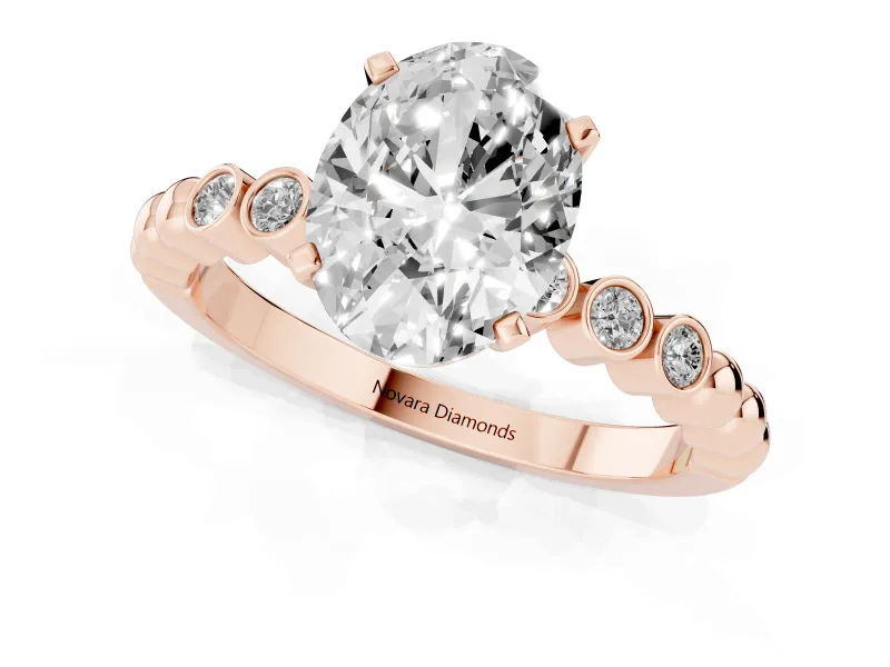 Oval Cut Diamond Solitaire Engagement Ring Set in Rose gold with Bezel Accents on Beaded Band