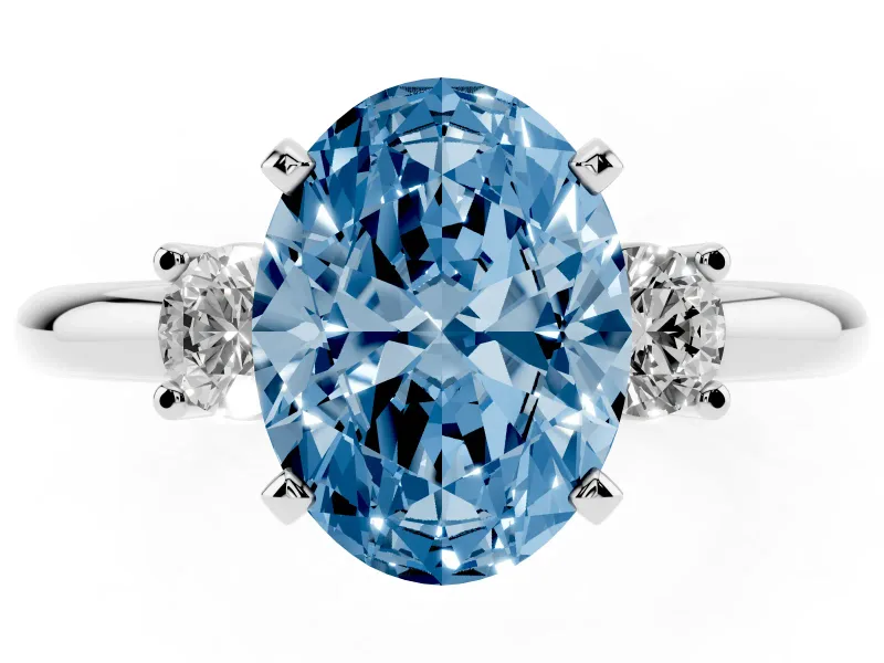 Fancy Blue Three-Stone Oval Cut Diamond Ring Set in Silver with Prong Setting and Plain Band