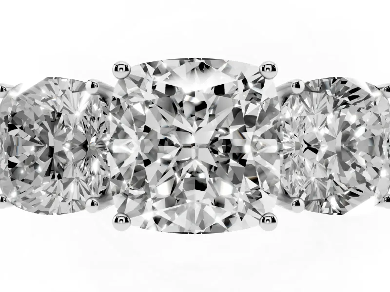 Cushion Cut Diamond Three-Stone Ring Set in Platinum with Textured Band