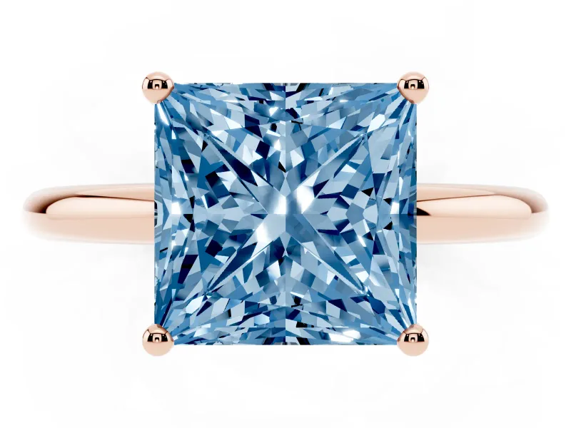 Fancy Blue Princess Cut Diamond Solitaire Engagement Ring Set in Rose gold with Prong Setting and Polished Band