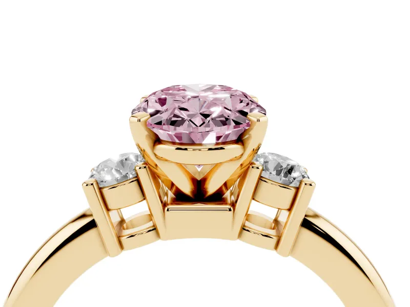 Fancy Pink Three-Stone Oval Cut Diamond Ring Set in Yellow gold with Prong Setting and Plain Band
