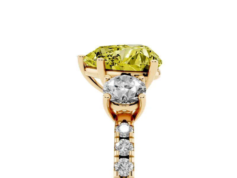 Fancy Yellow Heart Cut Diamond Three-Stone Ring Set in Yellow gold with Pavé Band and Graduated Sides