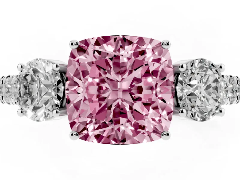 Fancy Pink Cushion Cut Diamond Three-Stone Ring Set in White gold with Round Side Stones and Delicate Pavé Band