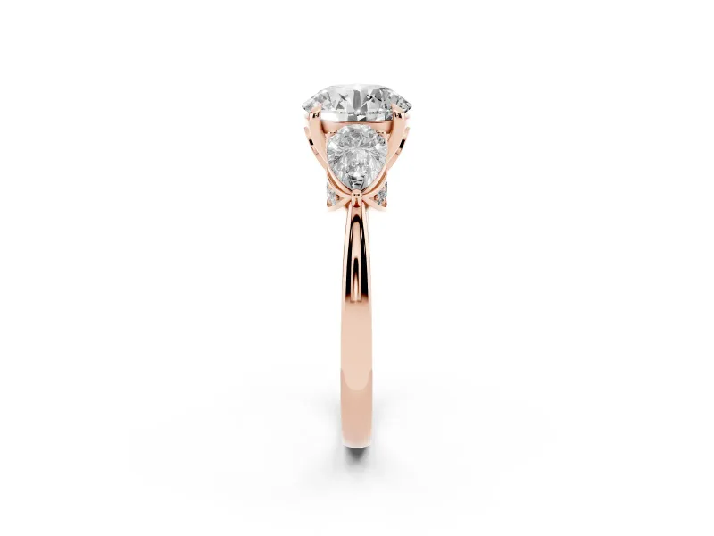 Round Cut Diamond Three-Stone Ring Set in Rose gold with Pear Side Stones