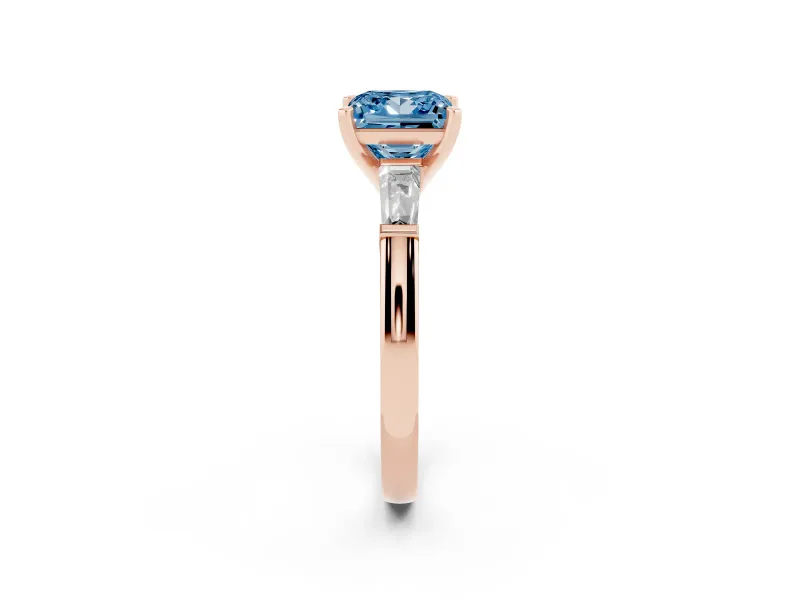 Fancy Blue Princess Cut Diamond Solitaire Ring Set in Rose gold with Tapered Baguette Side Stones and Prong Setting