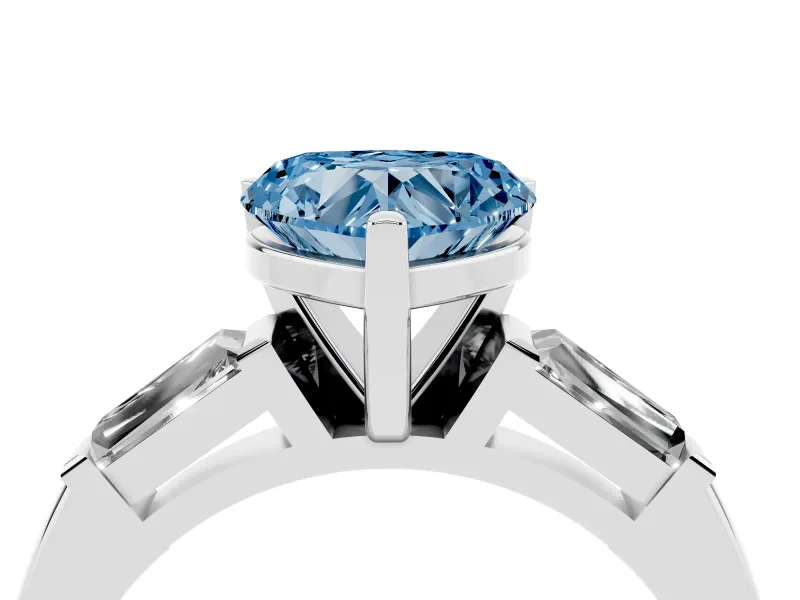 Fancy Blue Heart Cut Diamond Solitaire Ring Set in Silver with Tapered Baguette Side Stones and Prong Setting