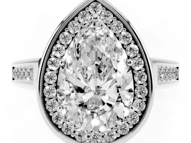 Pear Cut Diamond Halo Solitaire Ring Set in White gold with Pavé Band and Bezel Setting