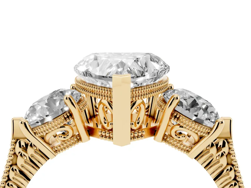 Heart Cut Diamond Three-Stone Ring Set in Yellow gold with Milgrain Band