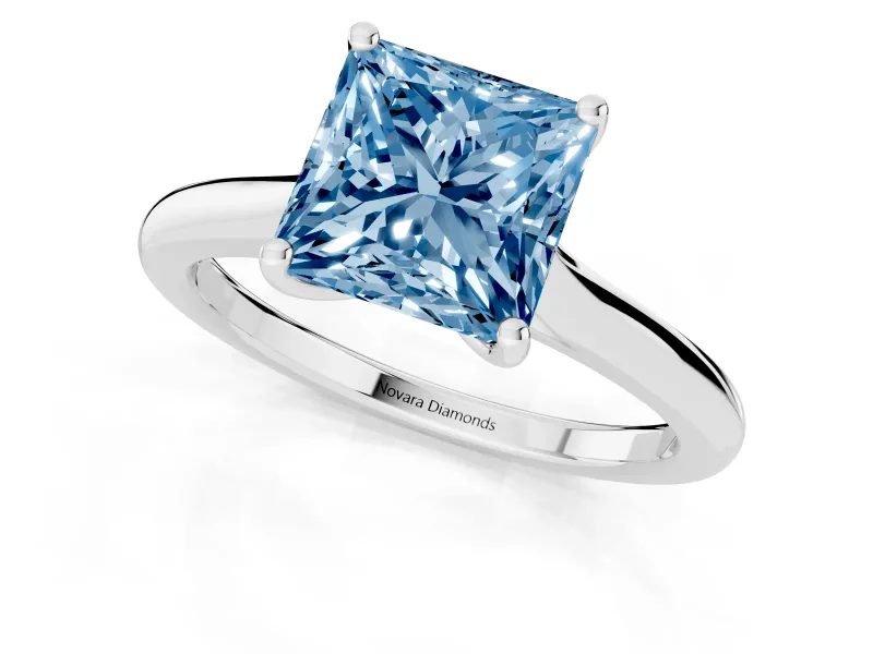 Fancy Blue Princess Cut Diamond Solitaire Ring Set in White gold with Cathedral Band and Prong Setting