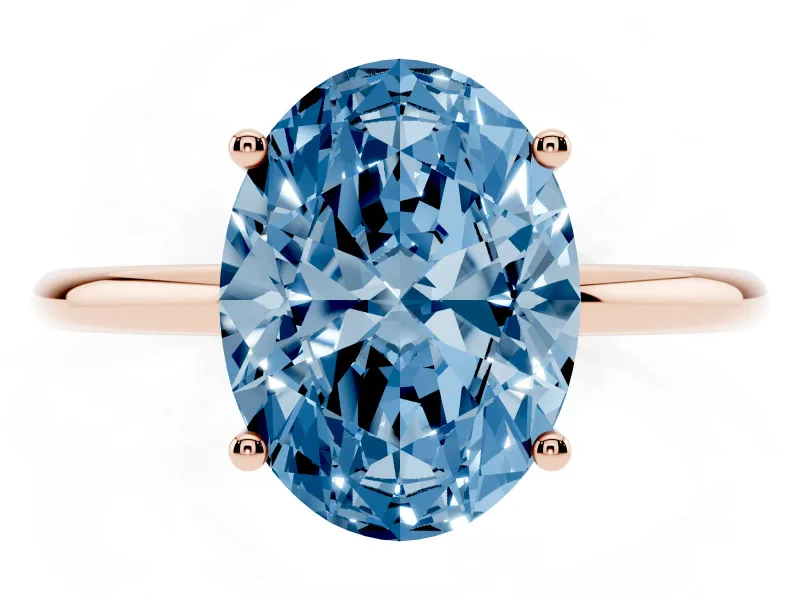 Fancy Blue Oval Cut Diamond Solitaire Engagement Ring Set in Rose gold with Thin Band and Prong Setting