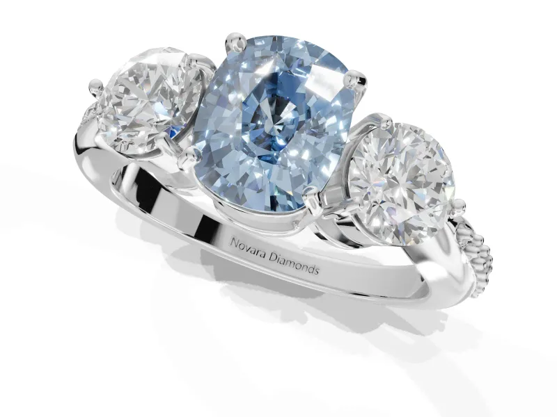 Cushion Cut Three Stone Engagement Ring Setting for a Fancy Blue Lab-Grown Diamond | Tapered Pave Band | White Gold