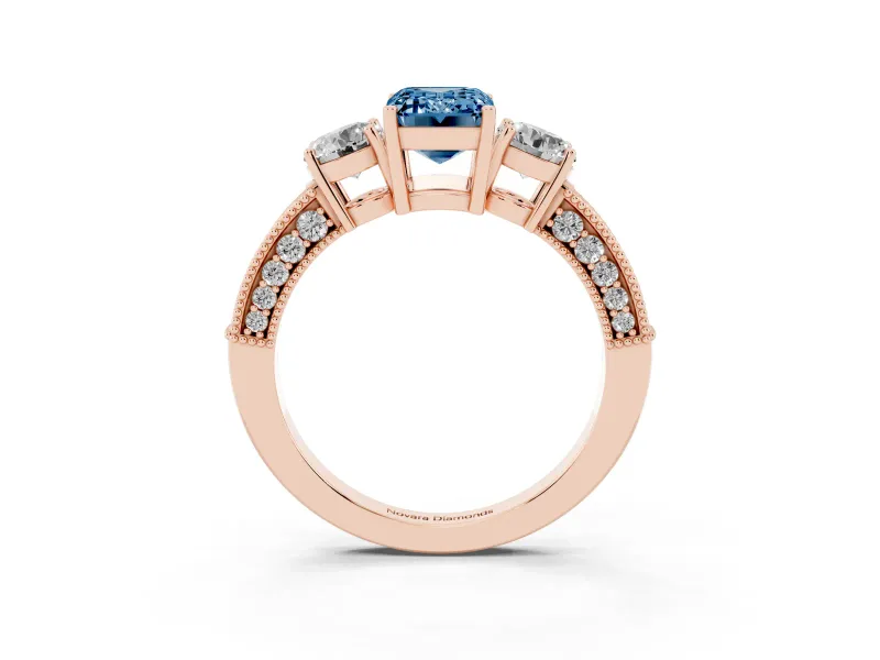 Fancy Blue Emerald Cut Diamond Three-Stone Ring Set in Rose gold with Round Side Stones and Pavé Band