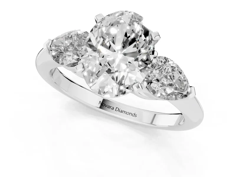 Three-Stone Oval Cut Diamond Ring Set in Silver with Pear Side Stones and Prong Setting