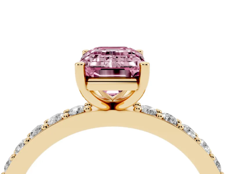 Fancy Pink Emerald Cut Diamond Solitaire Set in Yellow gold with Round Pavé Band and Prong Setting