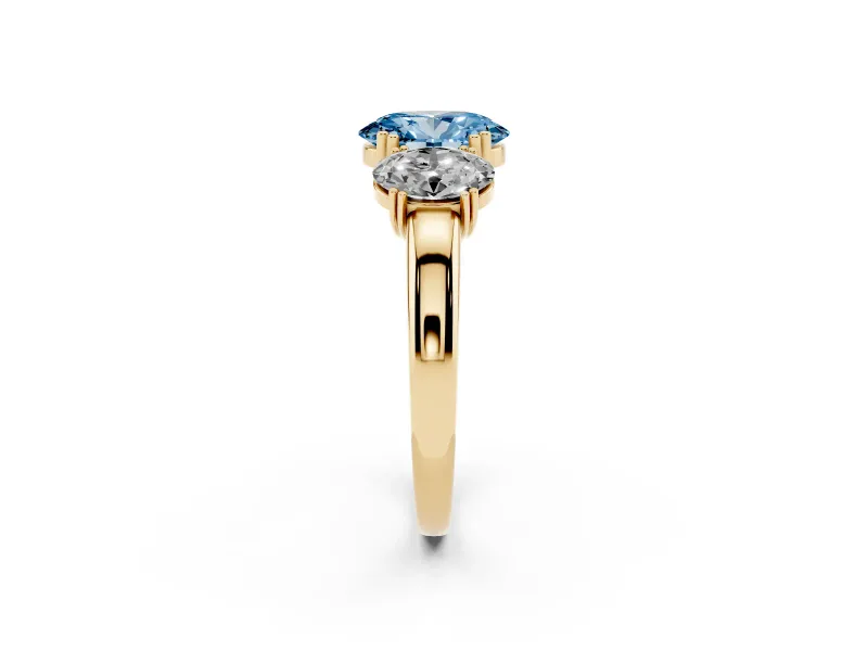 Fancy Blue Oval Cut Diamond Three-Stone Ring Set in Yellow gold with Polished Band and Prong Setting