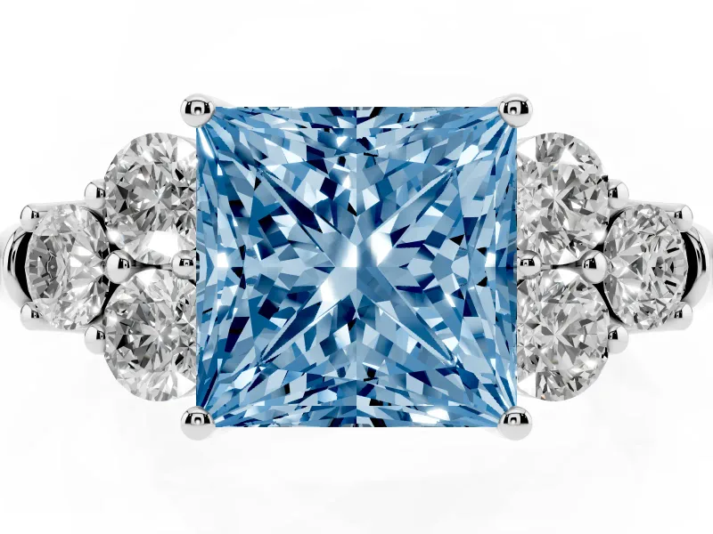 Fancy Blue Princess Cut Diamond Cluster Ring Set in Silver with Round Accent Stones and Prong Setting on a Plain Band
