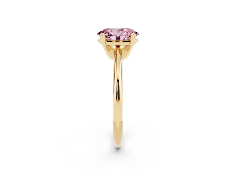 Fancy Pink Oval Cut Diamond Solitaire Ring Set in Yellow gold with Prong Setting on a Plain Round Band