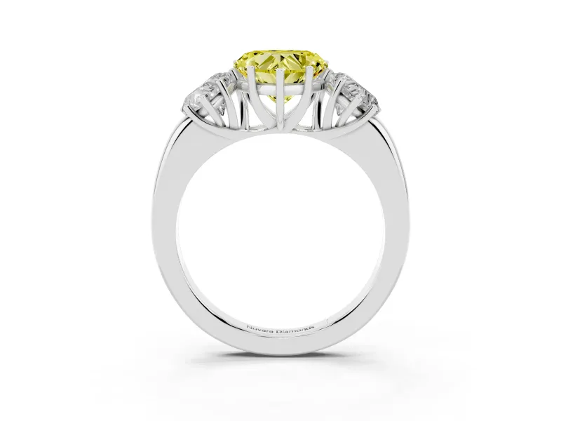 Fancy Yellow Heart Cut Diamond Three-Stone Ring Set in Platinum with Bold Center and Classic Band