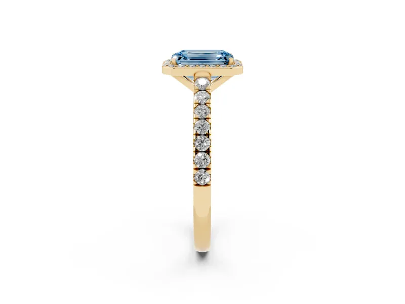 Fancy Blue Emerald Cut Diamond Halo Engagement Ring Set in Yellow gold with Pavé Band and Prong Setting