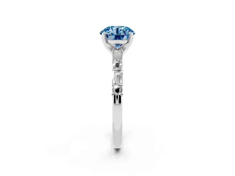 Fancy Blue Round Cut Diamond Solitaire Set in White gold with Side Baguettes and Channel Set Band