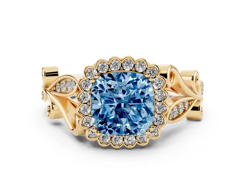 Fancy Blue Cushion Cut Diamond Halo Ring Set in Yellow gold with Leaf Motif Split Shank and Prong Setting
