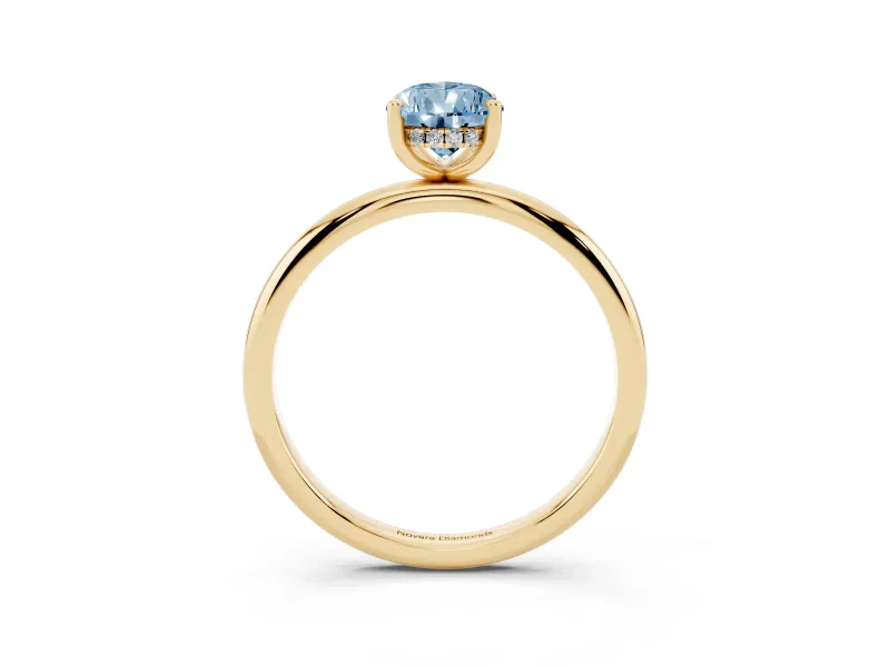Fancy Blue Pear Cut Diamond Solitaire Engagement Ring Set in Yellow gold with Prong Setting and Polished Band