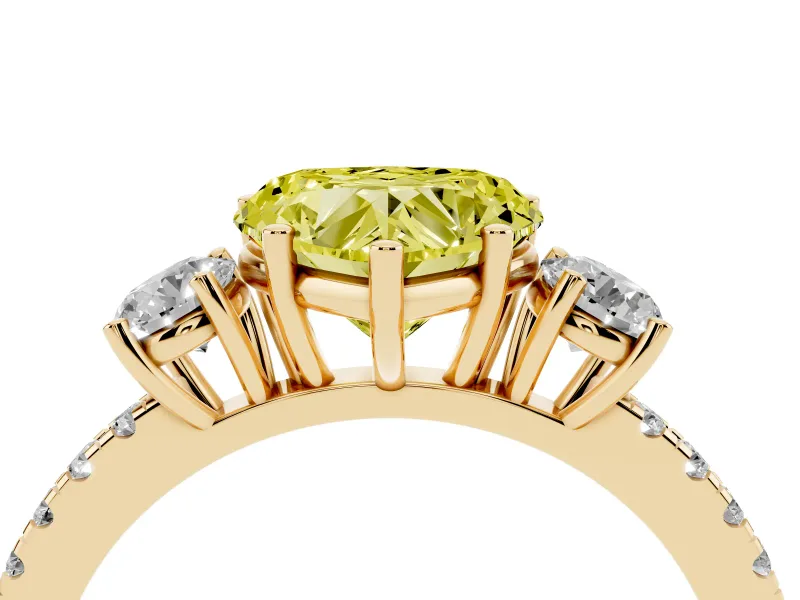 Fancy Yellow Heart Cut Diamond Three-Stone Ring Set in Yellow gold with Pavé Band and Graduated Sides