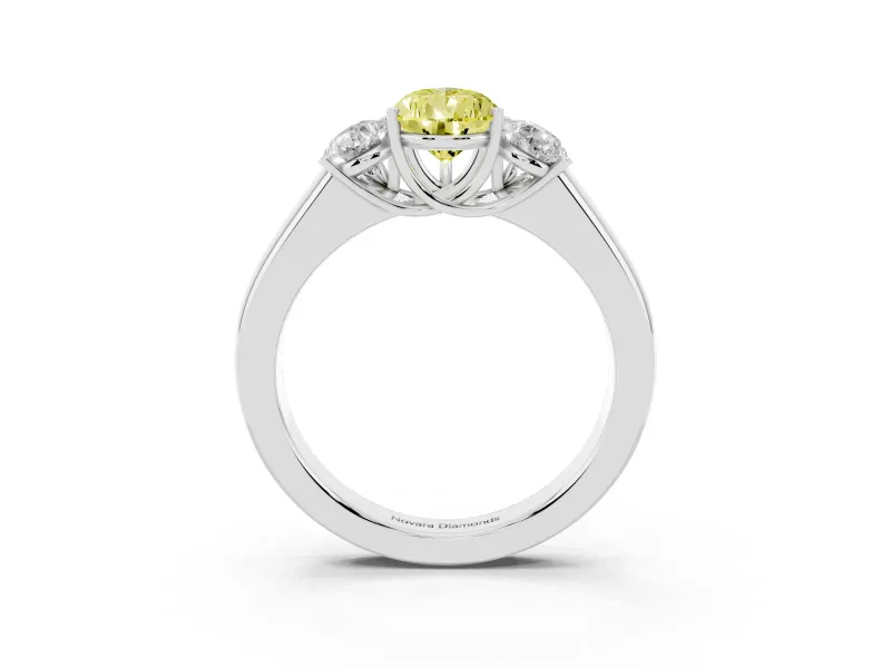 Fancy Yellow Three-Stone Pear Cut Diamond Ring Set in Platinum with Matching Prong Settings and Plain Band