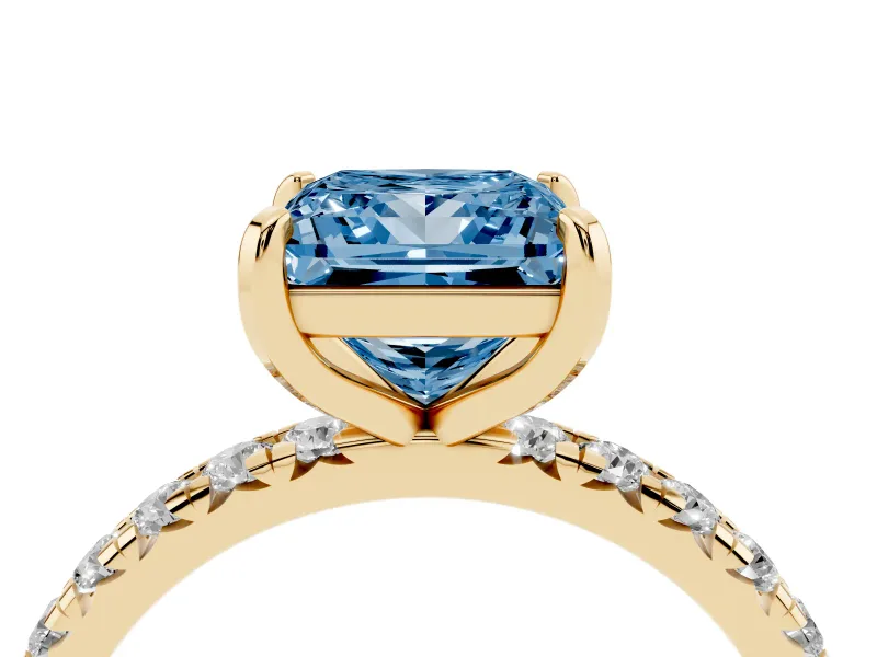 Fancy Blue Princess Cut Diamond Pavé Solitaire Ring Set in Yellow gold with Round Band and Prong Setting