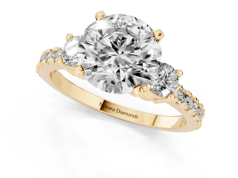 Three-Stone Round Cut Diamond Pavé Band Ring Set in Yellow gold with Prong Setting