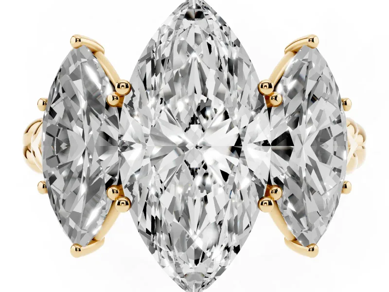 Marquise Cut Diamond Three-Stone Ring Set in Yellow gold with Braided Band