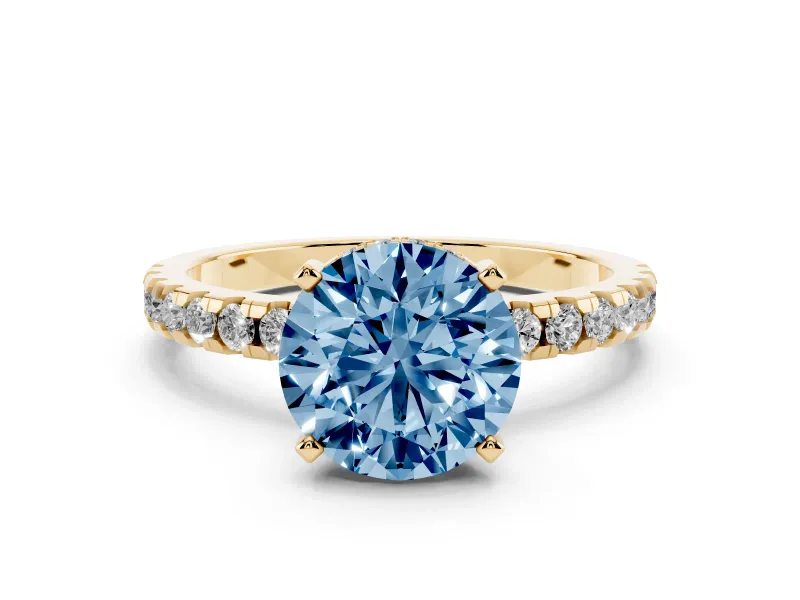 Fancy Blue Round Cut Diamond Pavé Solitaire Ring Set in Yellow gold with Round Band Accents and Prong Setting