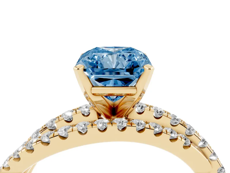 Fancy Blue Radiant Cut Diamond Solitaire Twist Band Ring Set in Yellow gold with Pavé Setting and Prong Head