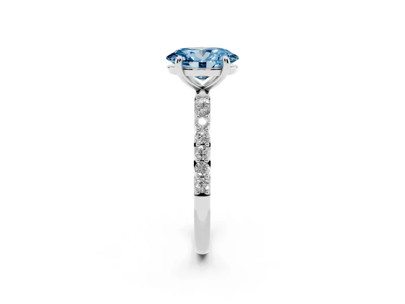 Fancy Blue Oval Cut Diamond Solitaire Ring Set in Silver with Round Pavé Band and Prong Setting