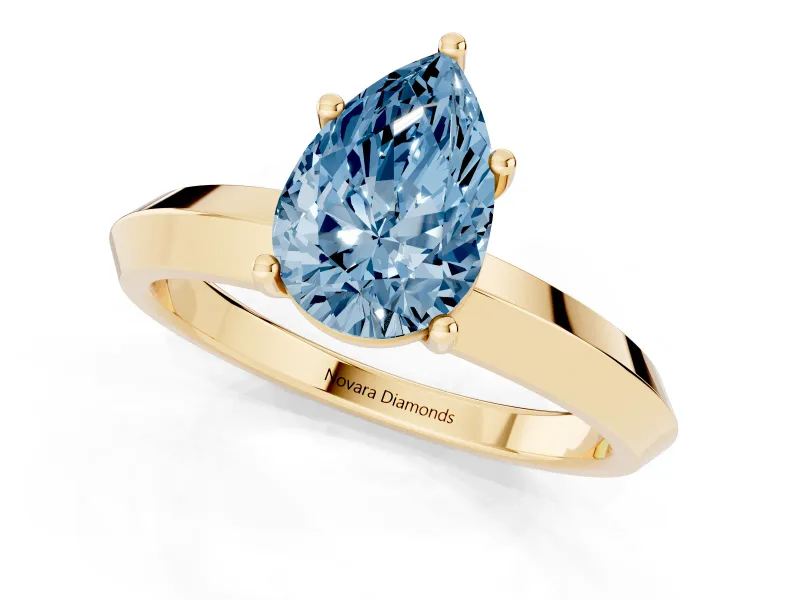 Fancy Blue Pear Cut Diamond Solitaire Engagement Ring Set in Yellow gold with Flat Band and Prong Setting