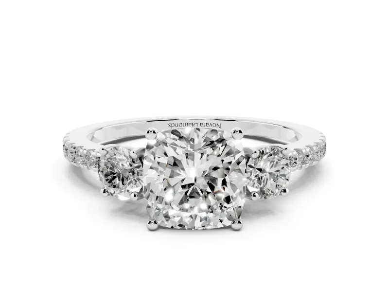 Cushion Cut Diamond Three-Stone Ring Set in Silver with Pavé Band and Graduated Sides