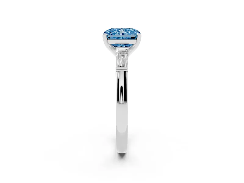Fancy Blue Radiant Cut Diamond Solitaire Ring Set in Silver with Tapered Baguette Side Stones and Prong Setting