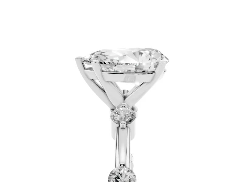 Pear Cut Diamond Solitaire Ring Set in Silver with Bezel Set Side Stones and Prong Setting