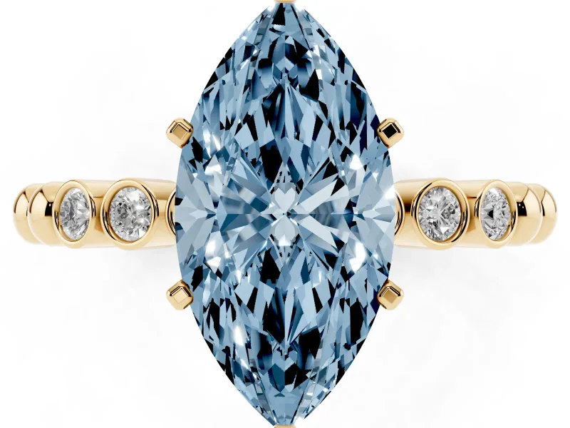 Fancy Blue Marquise Cut Diamond Solitaire Engagement Ring Set in Yellow gold with Bezel Accents on Beaded Band