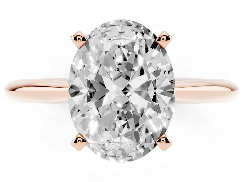 Oval Cut Diamond Solitaire Ring Set in Rose gold with Prong Setting on a Plain Round Band