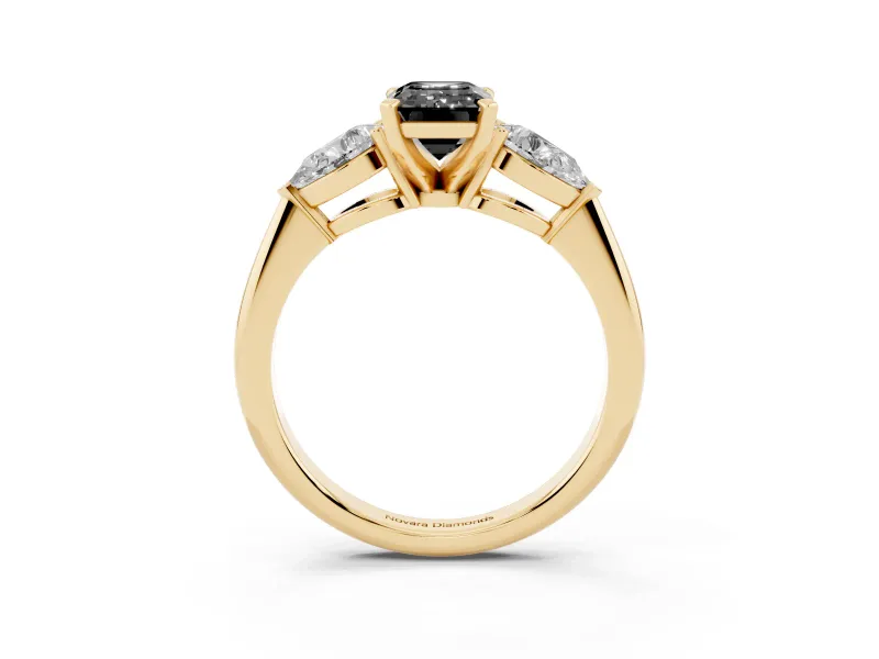 Fancy Black Three-Stone Emerald Cut Diamond Ring Set in Yellow gold with Pear Side Stones and Prong Setting