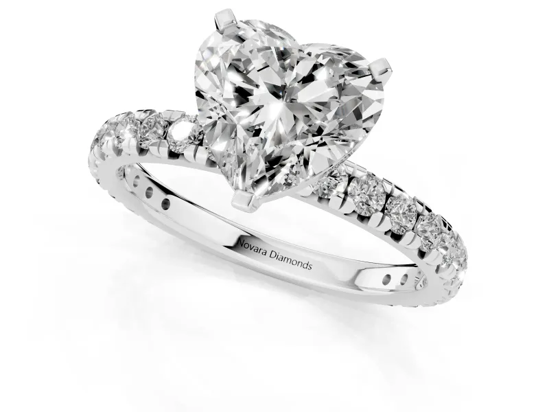 Heart Cut Diamond Pavé Solitaire Ring Set in White gold with Round Band and Prong Setting