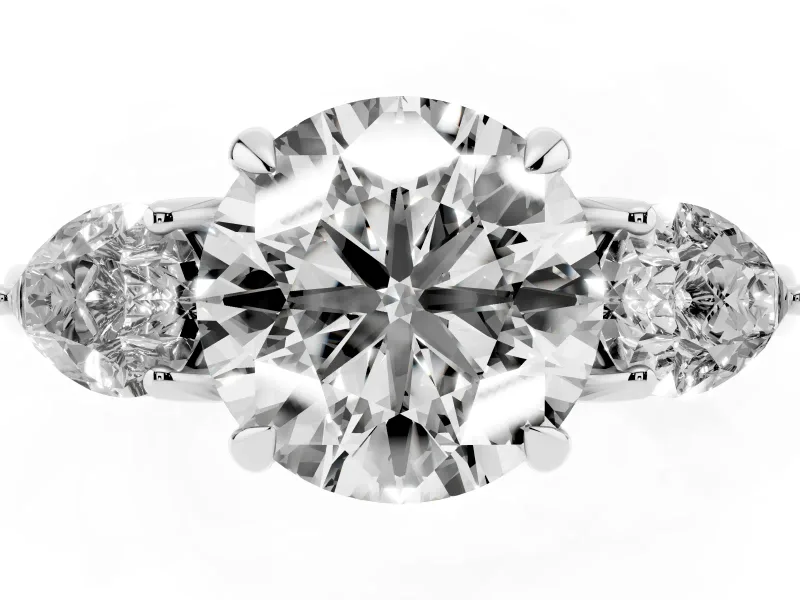 Round Cut Diamond Three-Stone Ring Set in White gold with Pear Side Stones