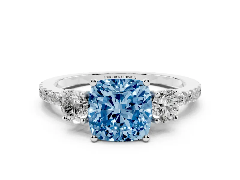 Fancy Blue Cushion Cut Diamond Three-Stone Ring Set in Platinum with Pavé Band and Graduated Sides