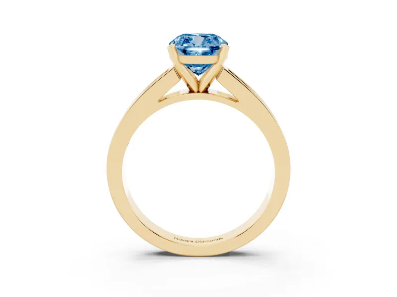 Fancy Blue Cushion Cut Diamond Solitaire Ring Set in Yellow gold with Channel-Set Band and Prong Setting