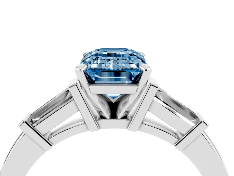Fancy Blue Emerald Cut Diamond Solitaire Ring Set in Platinum with Tapered Baguette Accents and Prong Setting