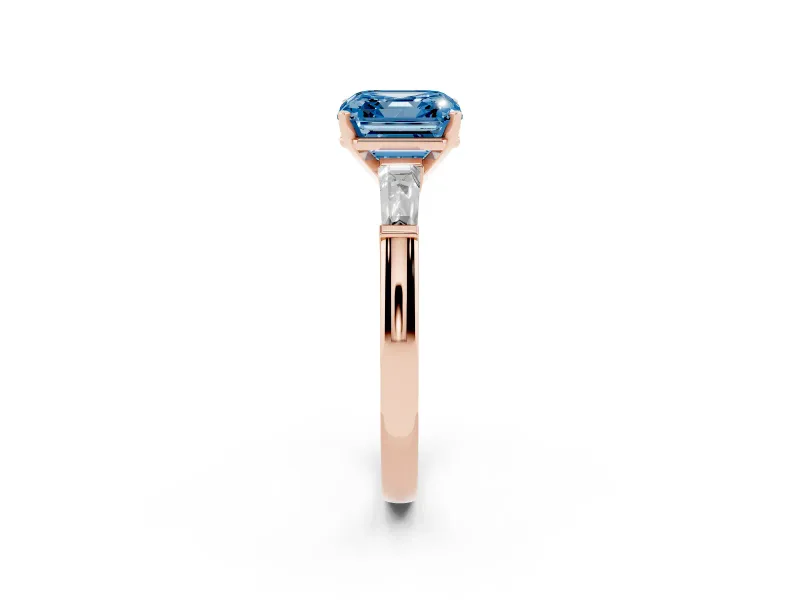 Fancy Blue Asscher Cut Diamond Solitaire Ring Set in Rose gold with Tapered Baguette Side Stones and Prong Setting