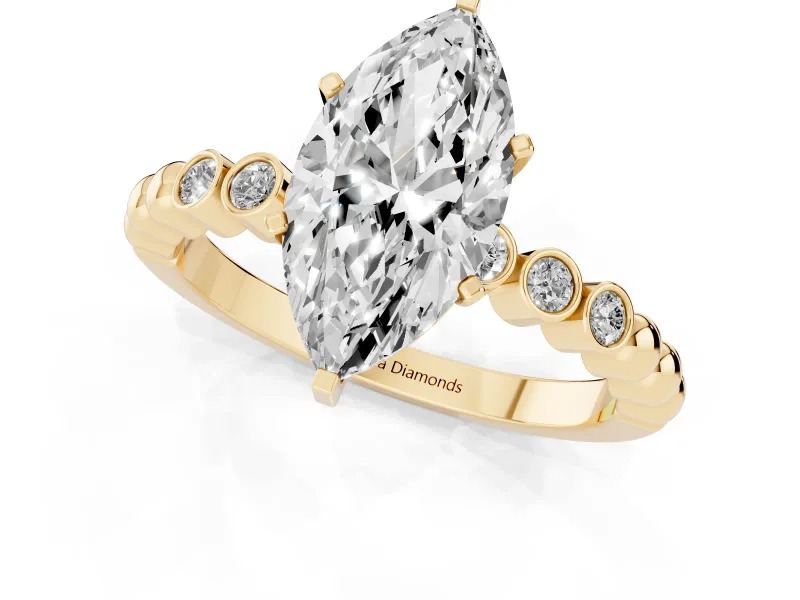 Marquise Cut Diamond Solitaire Engagement Ring Set in Yellow gold with Bezel Accents on Beaded Band