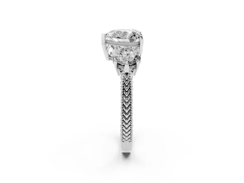 Heart Cut Diamond Three-Stone Ring Set in Platinum with Milgrain Band