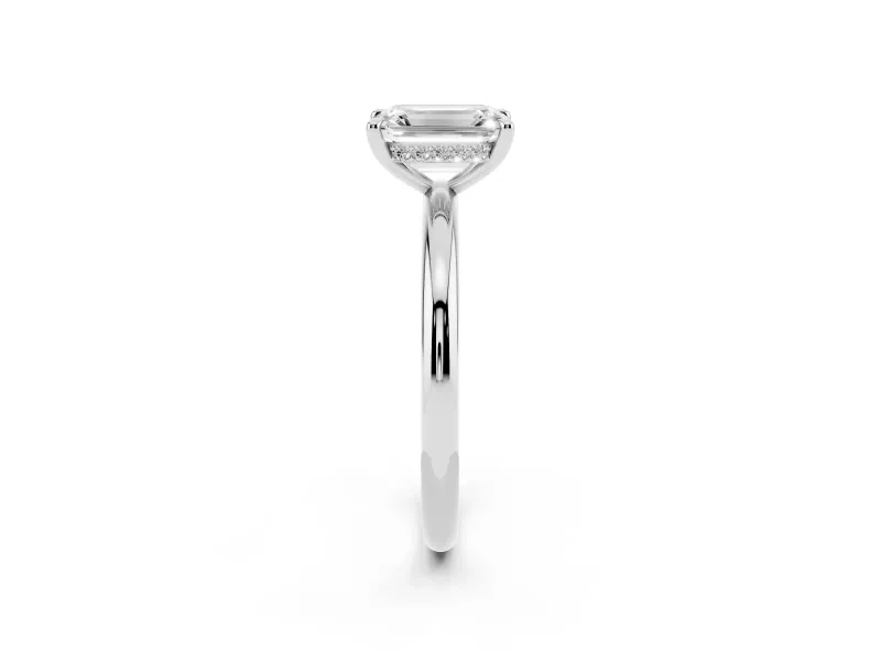 Emerald Cut Diamond Solitaire Ring Set in White gold with Thin Band and Prong Setting